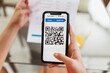 © Nexa - New form of payment of bills and bills in Brazil. Woman holding cell phone with pix app with QR-Code, x close-up of the screen.