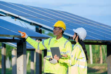 Poster - Engineer and Technician checking equipment in solar panels for great efficiency.