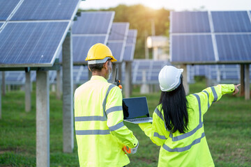 Poster - Engineer Woman Holding Digital Tablet Working Technician in Solar Panels Power Farm,Green Energy Concept.
