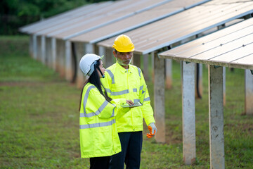 Poster - Engineer Woman Holding Digital Tablet Working Technician in Solar Panels Power Farm,Green Energy Concept.
