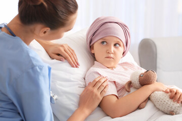 Sticker - Nurse and little girl undergoing course of chemotherapy in clinic