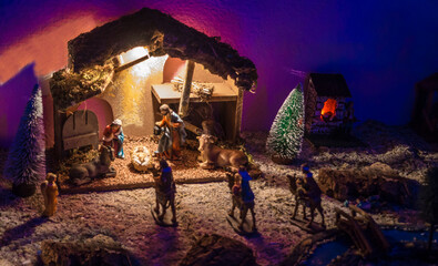 Christmas nativity scene illuminated in the dark