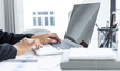 © Puwasit Inyavileart - Financial businesswomen use laptop to analyze marketing strategies and real estate data to reduce company taxes for their customers, Accounting and Tax concept.
