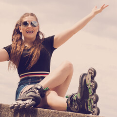 Sticker - Fit girl with roller skates outdoor