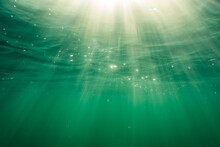 Ocean Surface Of The Baltic Sea With Beautiful Sun Rays Photographed From Underwater