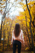© Dimitar - Back view of a young female in the autumn park