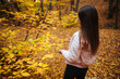 © Dimitar - Back view of a young female in the autumn park