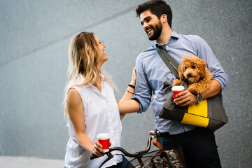 Wall Mural - Bicycle, love, couple, relationship and dating concept. Couple with bicycles in the city