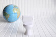 White toilet in the center on a white checkered background in honor of world toilet day 19 november