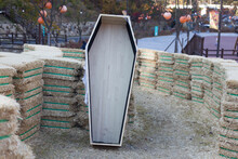 Photo Of Halloween Straw And Wooden Coffin.