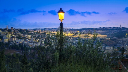 Wall Mural - Beautiful pre-dawn view from Scherover Promenade, overlooking Jerusalem - from Abu Tor and Mount Zion, across the Old city with Dome of the Rock on the Temple Mount, Hebrew University on Mount Scopus