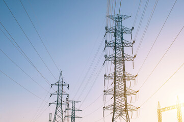 high voltage post.High-voltage tower sky sunset background.