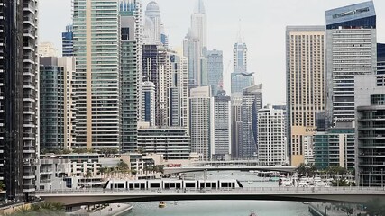 Wall Mural - Dubai Marina at with boats, bridges and tall buildings