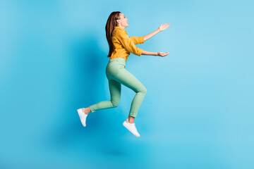 Poster - Full size profile photo of cool nice brunette lady jump hug wear shirt trousers sneakers isolated on turquoise color background