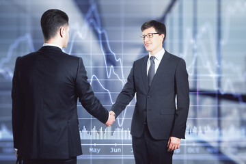 Poster - Two businessmen in suits shaking hands on the background of financial graph in the office, deal and partnership concept