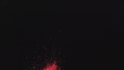 berries and red powder exploding in the air