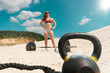 Woman   a crossfit beach workout