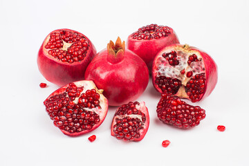 Pomegranate in composition in studio on white background