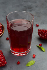 Wall Mural - Pomegranate juice in bottle and pomegranate fruit section