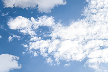 Wall Mural - white fluffy clouds in the blue sky