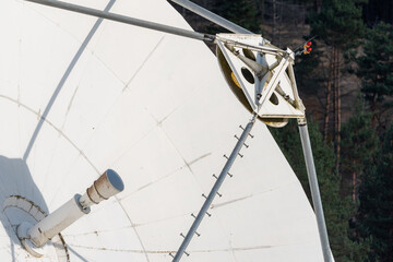 Solar radio telescope hidden in forest nature surveillance spy technology mobile antenna beautiful sunny autumn day