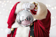 © Sean Locke - Santa Claus Holds Up A Disco Mirrored Ball