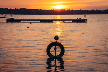 Sticker - Sunset over Narie lake of Ilawa Lake District in Kretowiny, small village in Warmia Mazury region of Poland