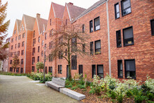 Row Of Modern Brick Residential Buildings Along A A Pedestrian Pathway In A Housing Development In Winter
