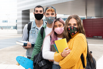 Wall Mural - group of happy students with facemask