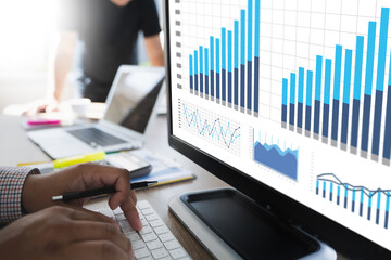 Wall Mural - Team work marketing  process Marketing strategy analysing stock Dashboard Strategy Research Concept