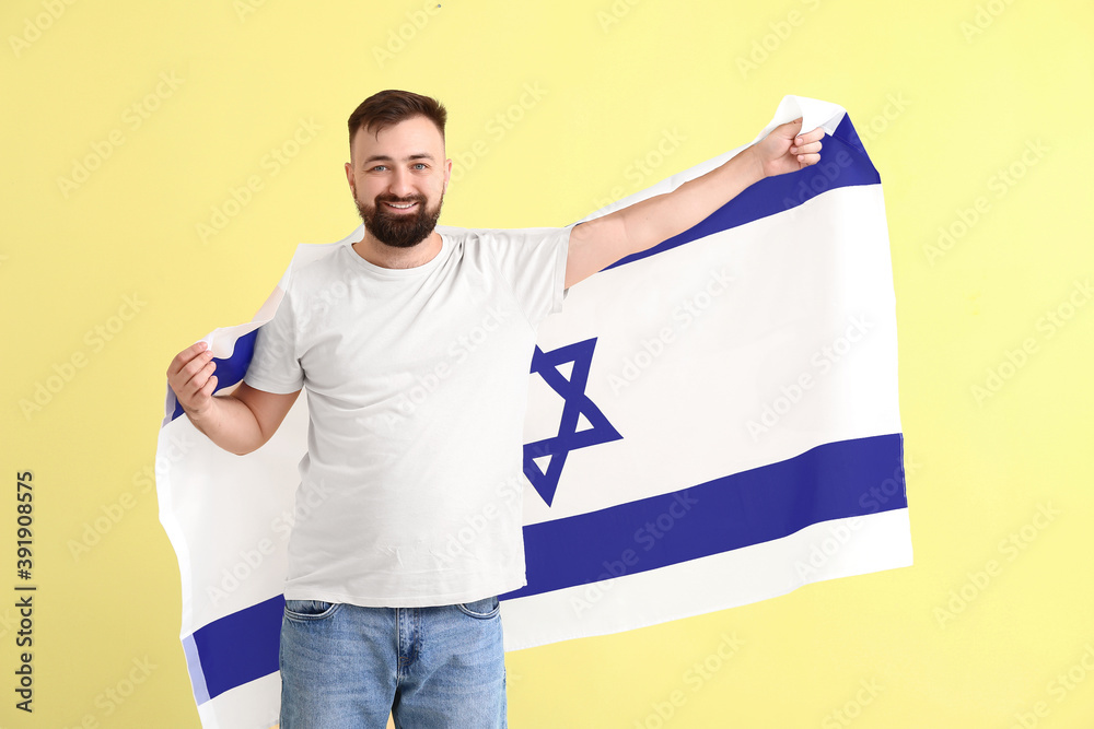 Man with the flag of Israel on color background