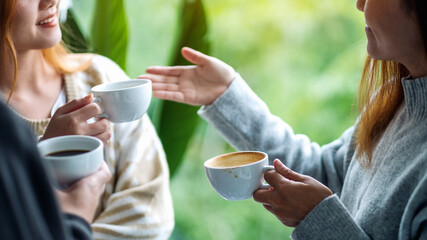 Canvas Print - Closeup image of people enjoyed talking and drinking coffee together