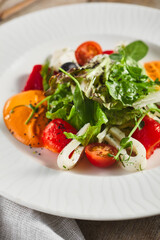 Roasted pepper salad with calamari and fresh greens