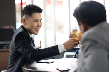 Wall Mural - Group Of Asian Friends Enjoying Evening Drinks in bar. Celebration, Party People Christmas and Happy new year concept. Asian business people in party.