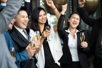 Group Of Asian Friends Enjoying Evening Drinks in bar. Celebration, Party People Christmas and Happy new year concept. Asian business people in party.