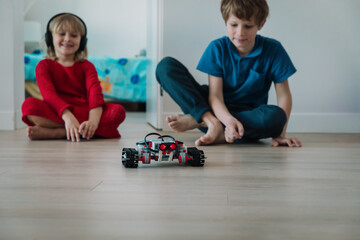 Wall Mural - kids testing robot they built at home, STEM for kids