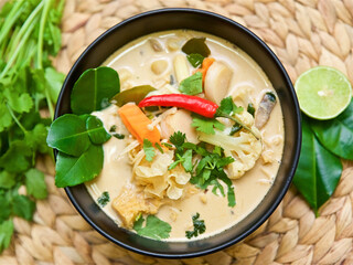 traditional Thai soup tom kha and tom yam with spices in coconut milk, Asian vegetarian and vegan food