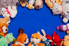 Lots Of Baby Soft Toys For Developing Games Boy On A Blue Background