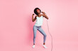Full body photo of carefree person dancing singing light blue singlet isolated on pink color background