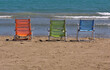 © insideportugal - Three colored beach chairs