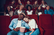 © freeograph - Multiethnic couple in love is sleeping in cinema.