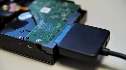 Poster - Concept of neuronet and computer technologies. Media. Close up of connecting an external adapter to a computer circuit board on white table background.