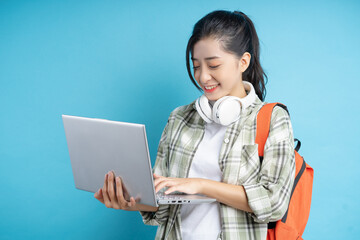 Wall Mural - students holding computers determined to study