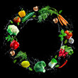 © Alexander Raths - Assortment of fresh vegetables and water splashes on black background