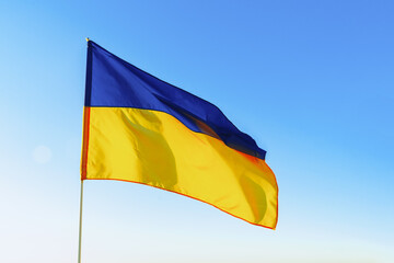 Flag of Great Britain waving against blue sky