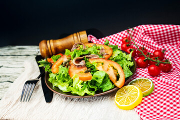 Wall Mural - Fresh salad - Delicious fresh salad with tomatoes, lettuce, eggplant, zucchini, cheese, Parma ham and olive oil.