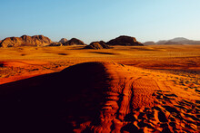 Sunset Over The Sand Dunes And Mountains Of Wadi Rum, Jordan