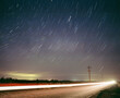© Cavan Images - Star Trails above road with long exposure car and telephone pole