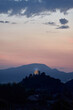 © Cavan Images - Landscape of a monastery on top of a mountain. Sunset light