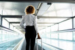 © Cavan Images - stewardess with her suitcase going to work